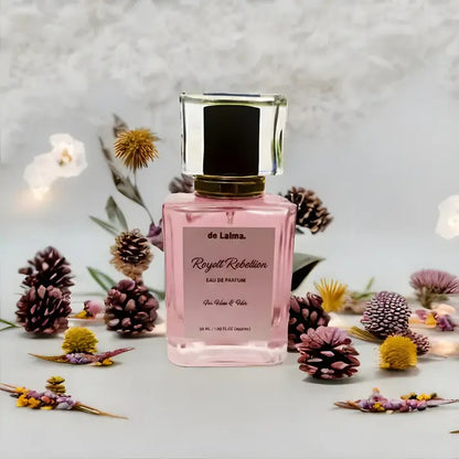Royal Rebellion eau de parfum by de Lalma - Inspired by Bright crystal by Versace, long lasting perfume, showcased in an elegant botanical arrangement with dried flowers, pine cones, and soft natural lighting
