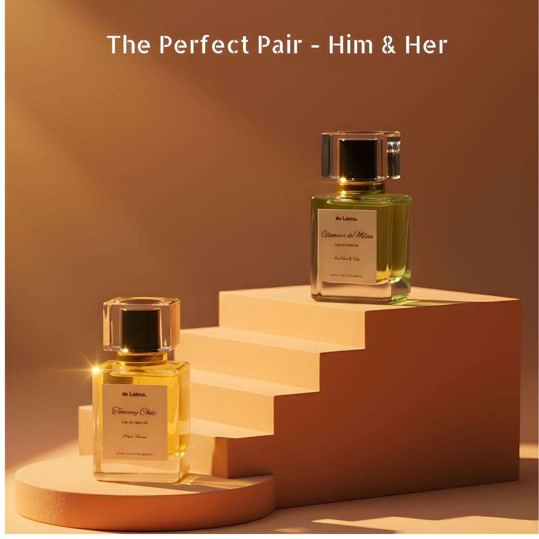 The Perfect Pair Him & Her by de Lalma, long lasting and luxury perfume bundle featuring Glamour de Milan (Impression of Aqua di Gio Profundo by Armani) and Tommy Chic (Impression of Tomy Girl by Tomy Hellfiger), displayed on premium display steps with warm studio lighting.