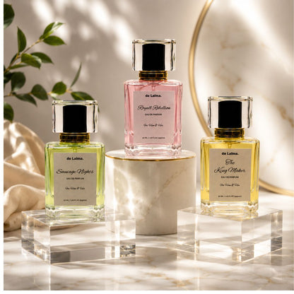The Top Three perfume bundle by de Lalma, featuring three luxury, long lasting fragrances: Sauvage Nights (impression of Sauvage by Dior, Royal Rebellion (Impression of Bright crystal by Versace and The King Maker (Impression of Hugo Boss) displayed on glass podiums.