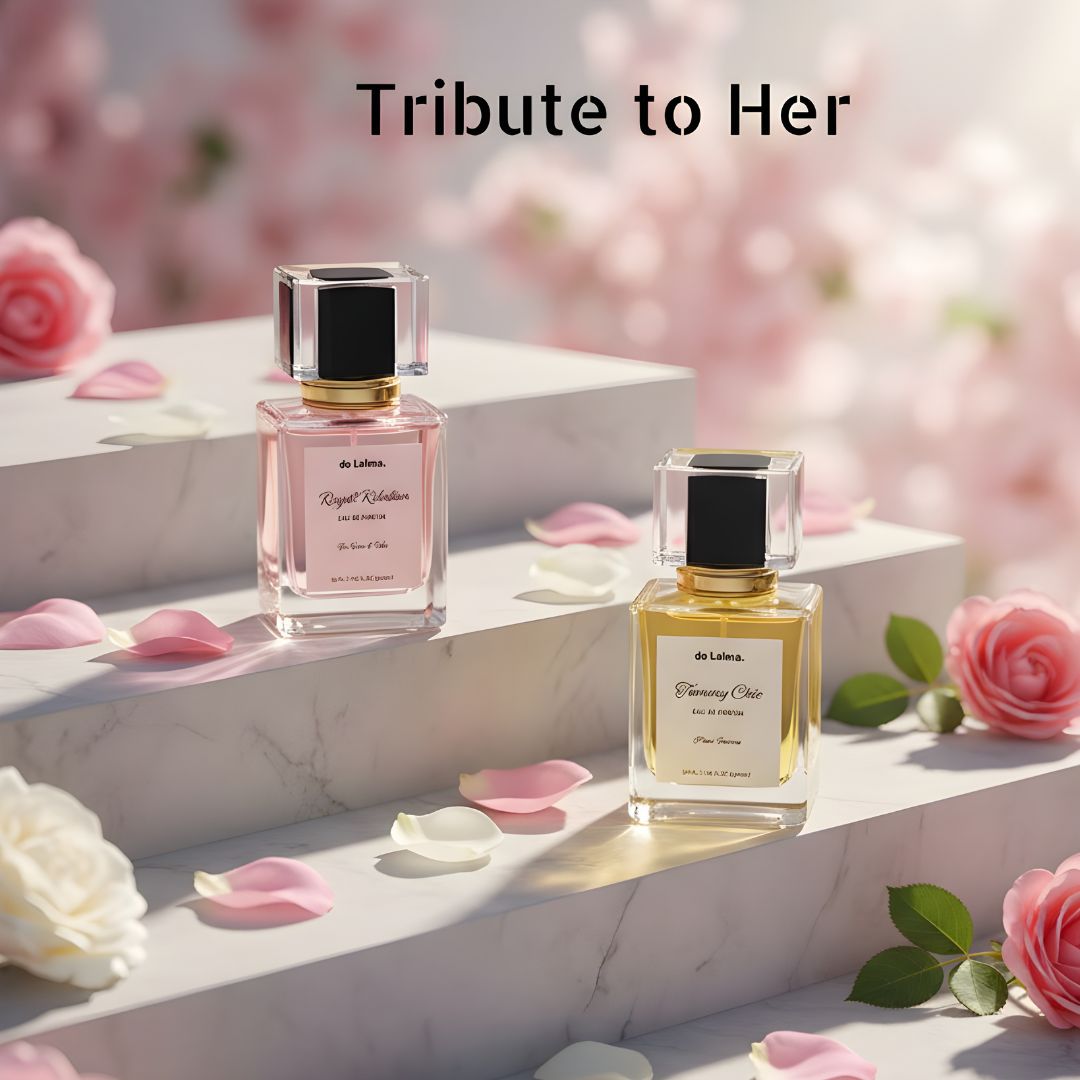 Tribute to Her, luxury and long-lasting perfume bundle by de Lalma, featuring two luxury fragrances: Royal Rebellion (Impression of Bright crystal by Versace) and Tommy Chic (Impression of Tommy Girl by Tomy Hellfiger), displayed on elegant marble steps surrounded by blooming roses and delicate flower petals.