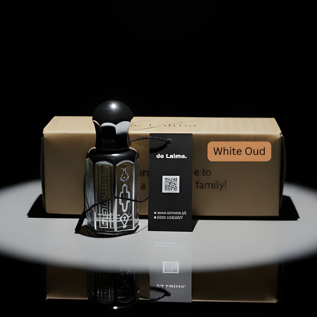White Oud Purity by de Lalma, long lasting, luxury oud perfume bottle with premium gift packaging displayed on a reflective black surface