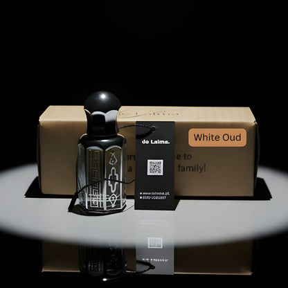 White Oud Purity by de Lalma, long lasting, luxury oud perfume bottle with premium gift packaging displayed on a reflective black surface