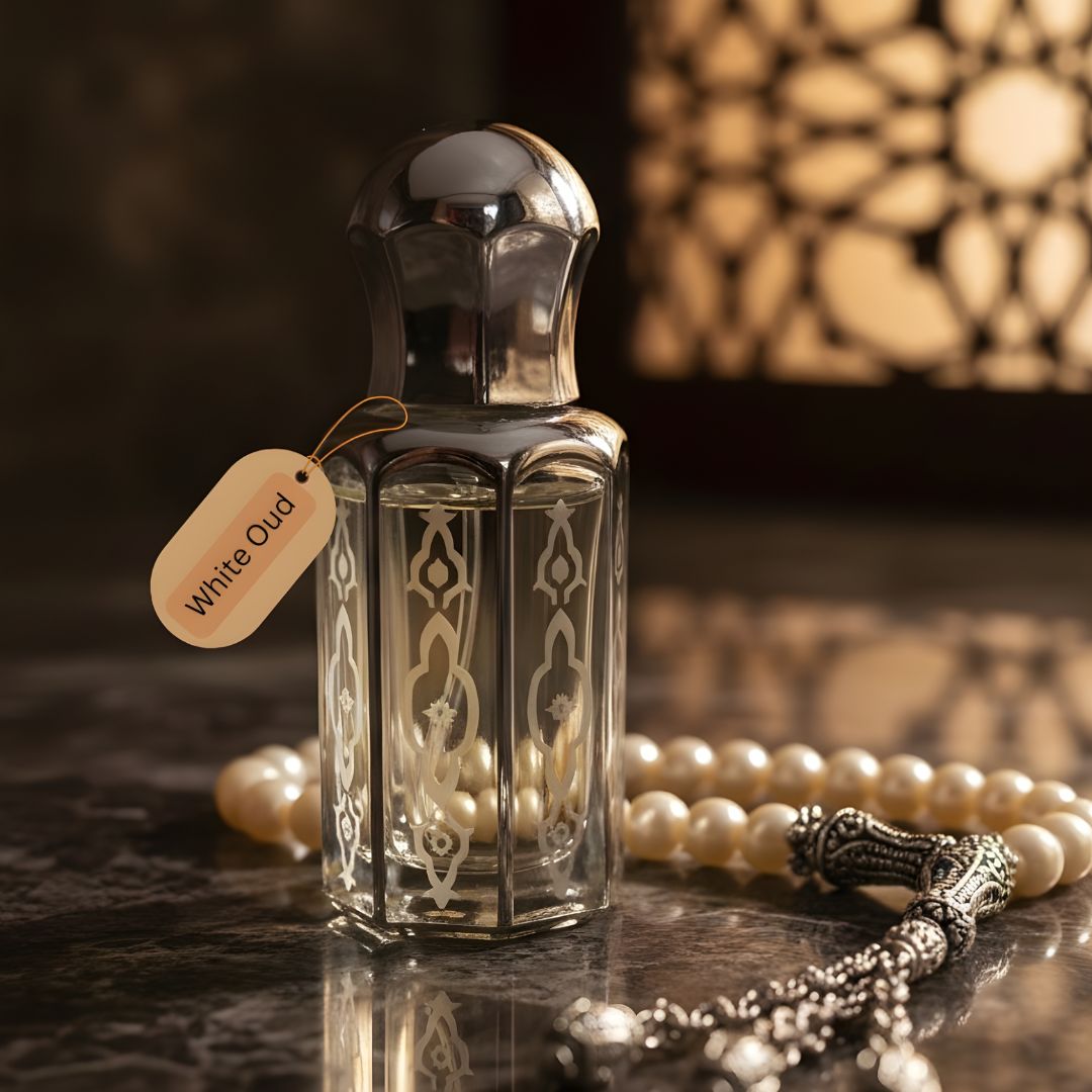 White Oud by de Lalma, Long Lasting, Purity luxury oud perfume bottle displayed with prayer beads in an elegant Arabian-inspired setting