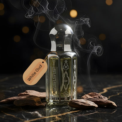 White Oud Purity by de Lalma Long lasting, luxury oud perfume bottle surrounded by aromatic smoke on a dark marble surface